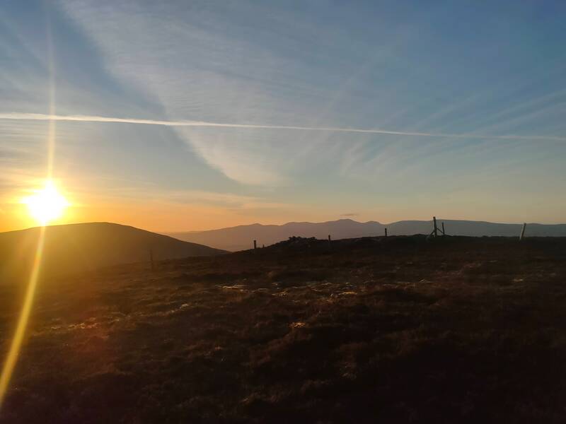Sun setting behind the Galtys looking across from the descent of Knockshanahullion