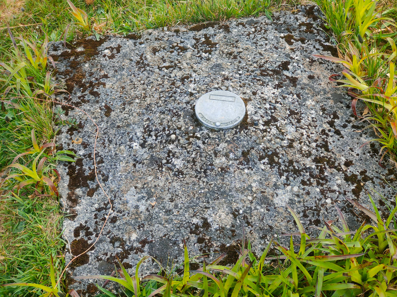 Square concrete slab marking the high point of Laois and Offaly