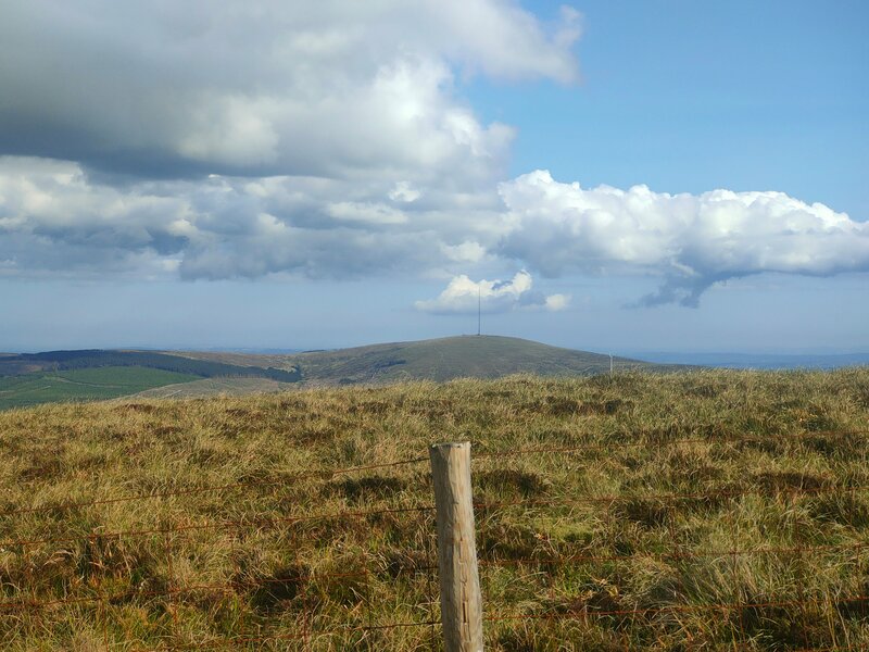 Mullaghanish mountain on partly cloudy Blue Sky horizon from grassy Caherbarnagh