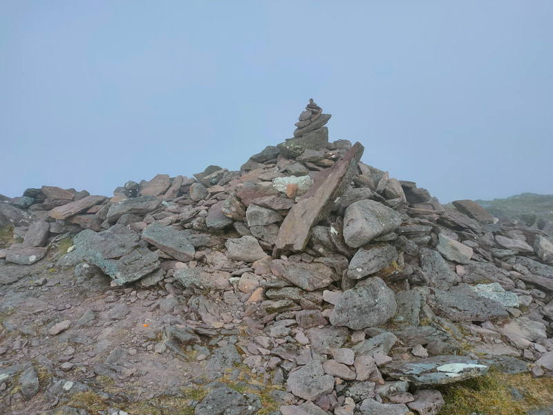 A small pile of stones marking the top of Knockbrinnea East Top
