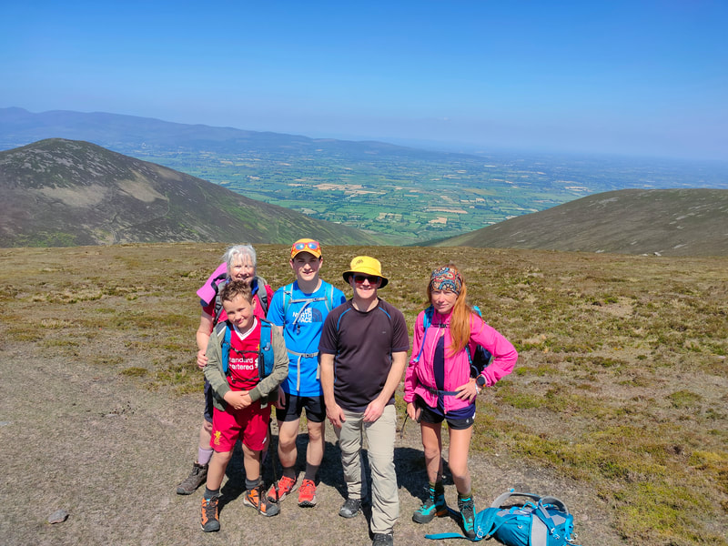 Deirdre McEniry AKA Nan, Oscar, Dillon, Group picture of Dad and Carolyn Sugarloaf Hill in background
