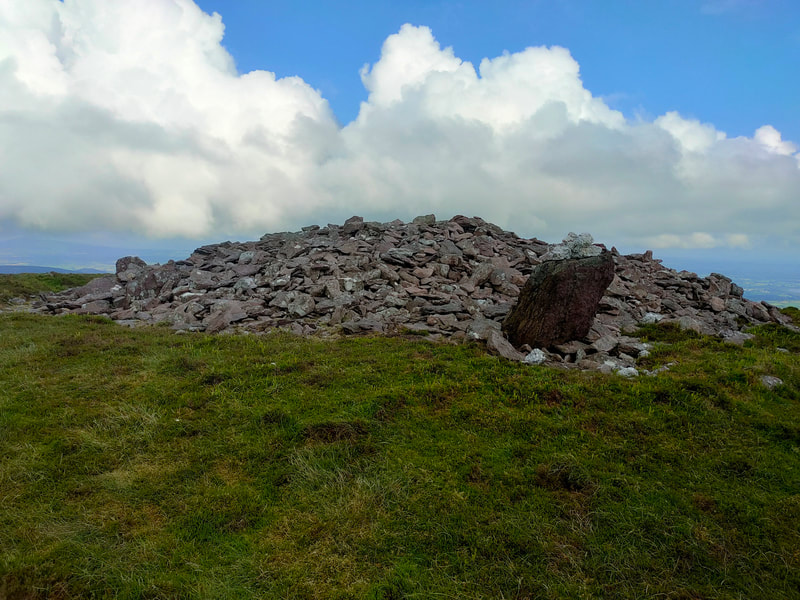 Cairn of stones and standing stone of Knocknafallia E