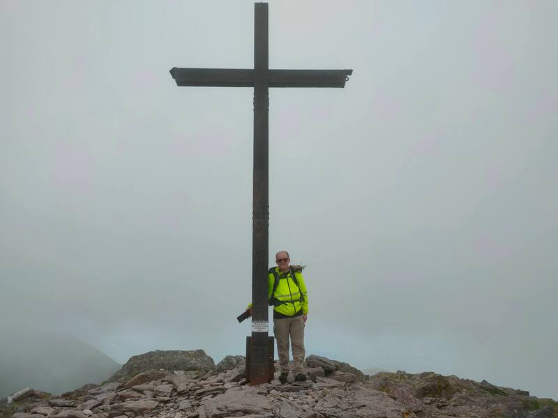 Dad standing at the Cross of Carrauntoohil
