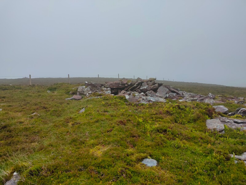 Small pile of stones marking the top of Knocknalougha