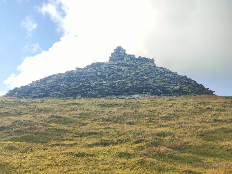 Large Cairn of stones on top of The Paps East