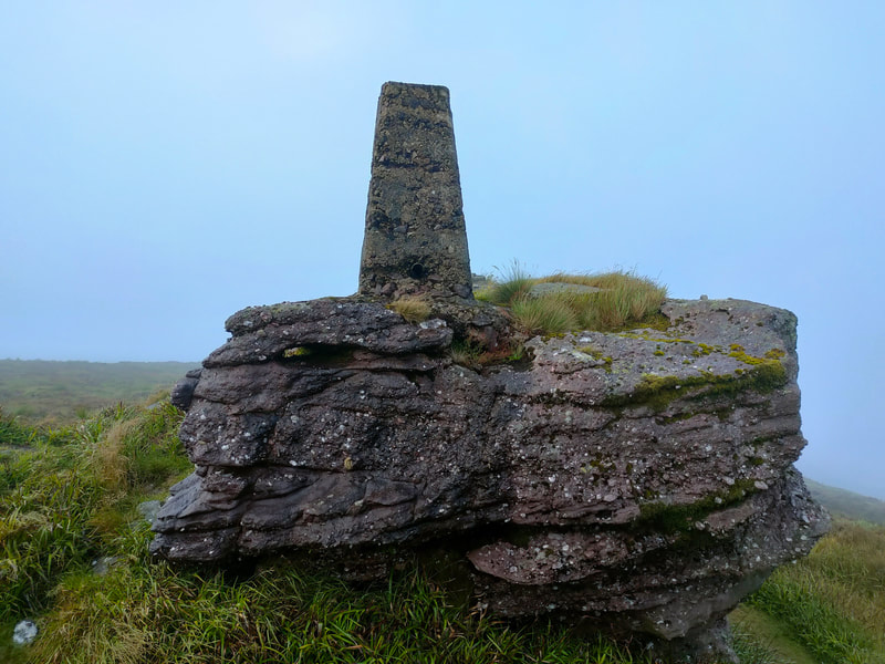 Seefin Trig Pillar standing on a rock outcrop