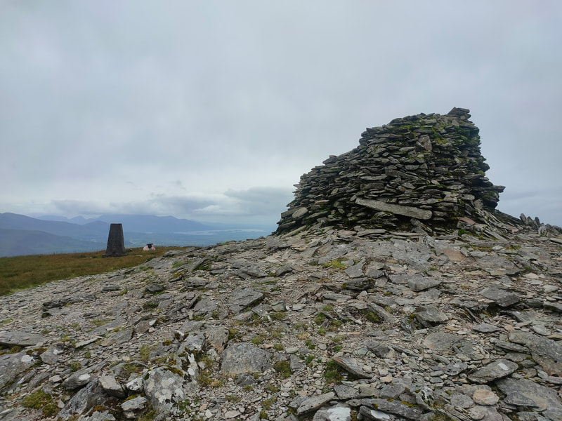 Pile of stones and Trig Pillar mark the summit of The Paps West