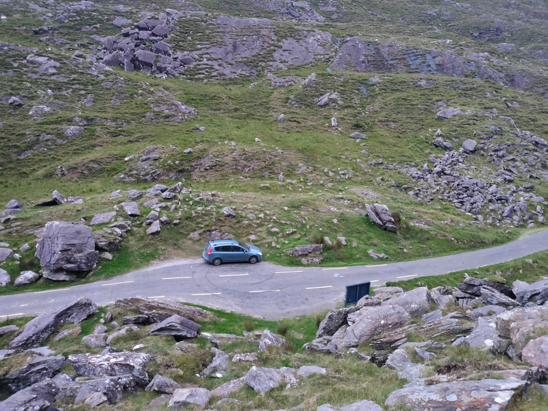Car parked at Ballaghbeama Gap looking down from high above the gap