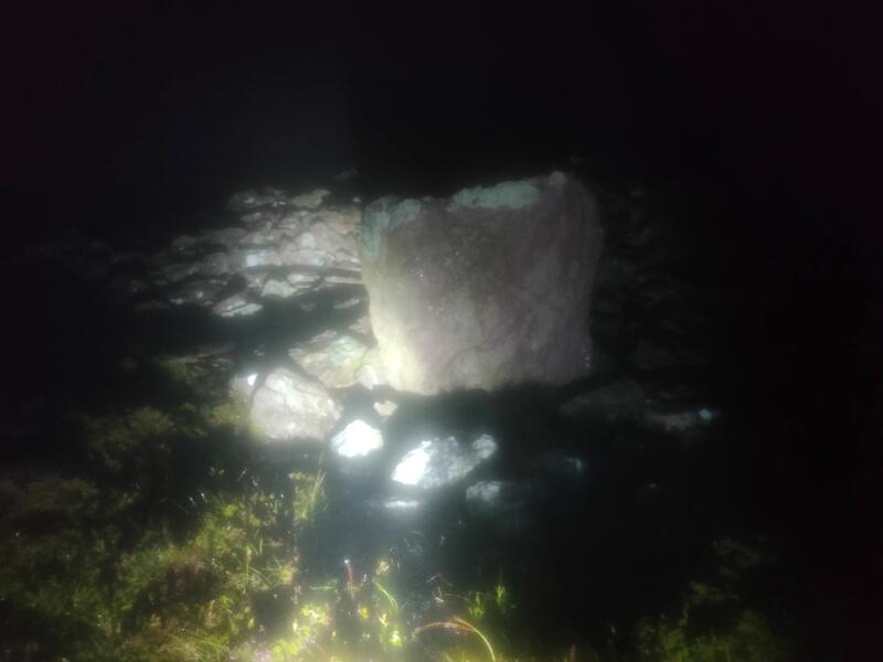 Large stone that marks Knocknafallia East under torch light