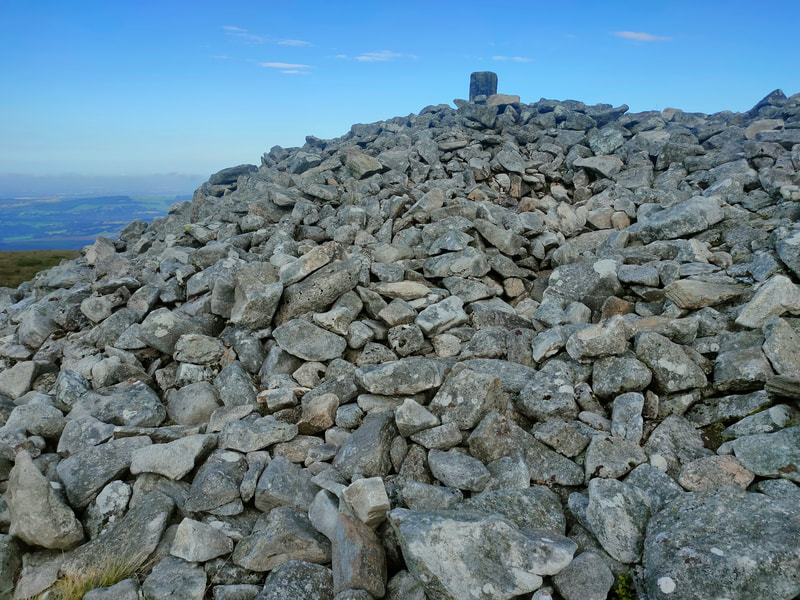 Very large mound of rocks and Trig Pillar on Seefingan Mountain