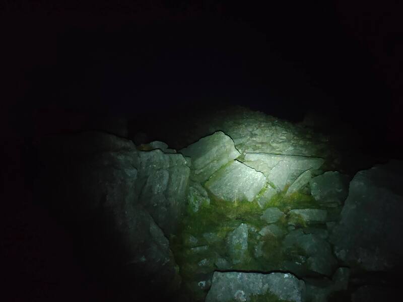 Torch light on large rocks