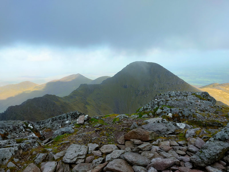 Beenkeragh Ridge with Beenkeragh rising to the dark clouds