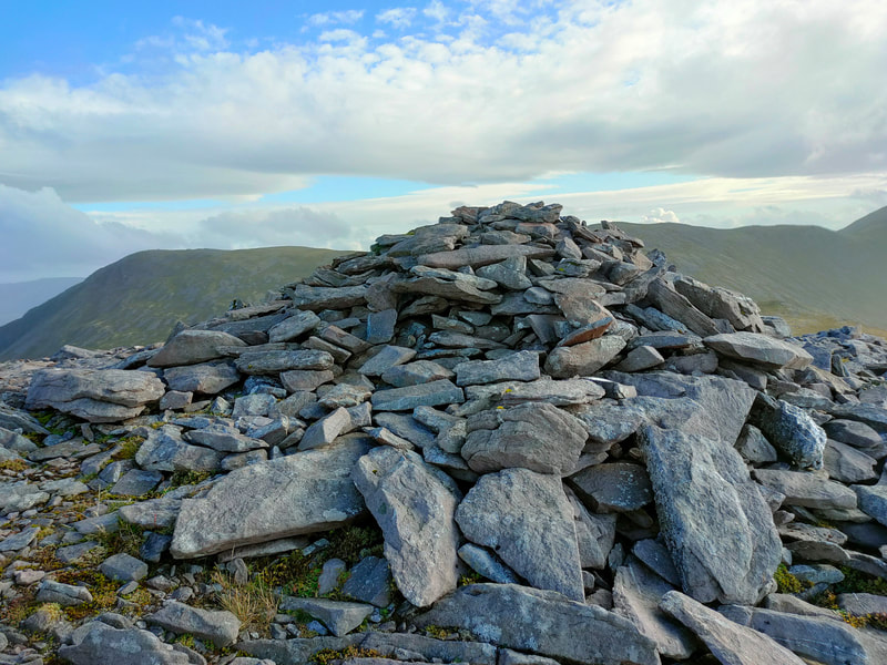 Pile of stones on top of Tomies Mountain