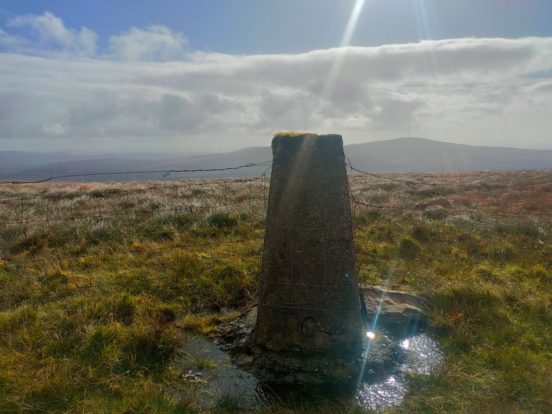 Trig Pillar of Caherbarnagh with Mullaghanish in the background