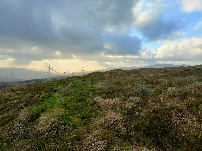 Mountain side with wind turbines