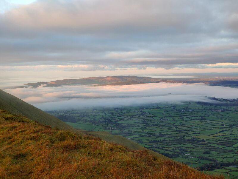 Cloud inversion strip with some farm land visible