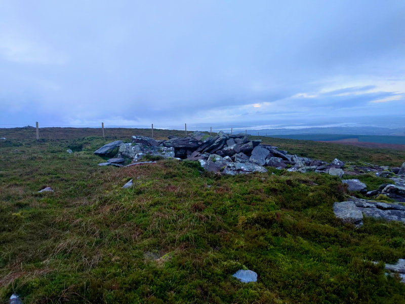 Pile of stones marking the top of Knocknalougha 