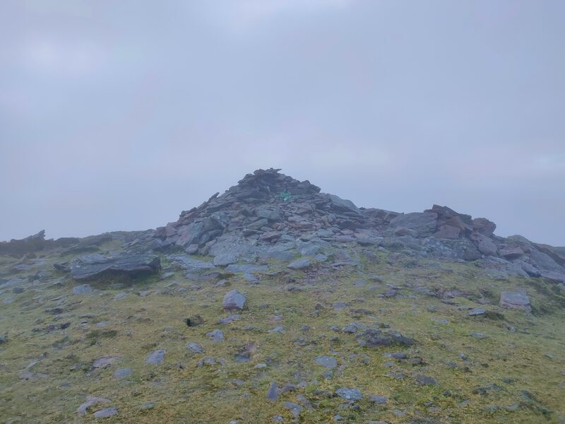 A pile of stones marking the top of Sugarloaf Hill
